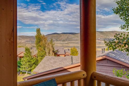 a view from a porch window with mountains in the background at Jordanelle Jubilee in Heber City