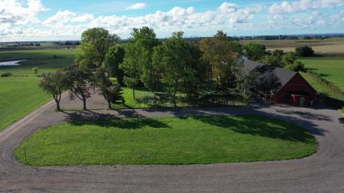 an aerial view of a farm with a barn and trees at GEG Hotel in Landskrona
