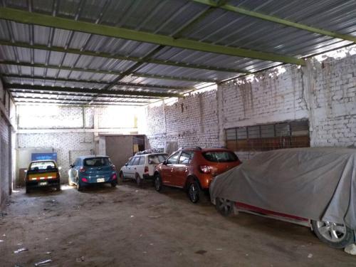 a group of cars parked in a garage at Departamento-Natural M4 in Chiclayo