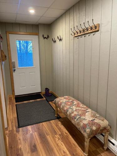 a room with a door and a bench in front of it at Mandy's Mountain Chalet in Dover