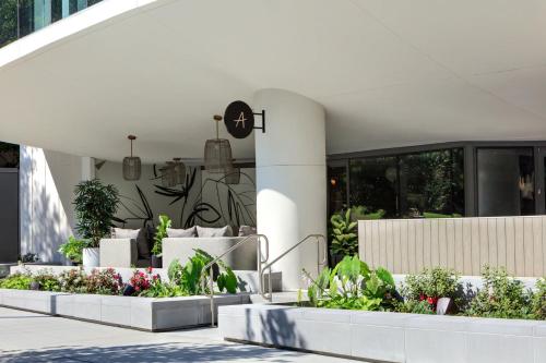 a building with three planters with plants in it at Kimpton Shane Atlanta, an IHG Hotel in Atlanta