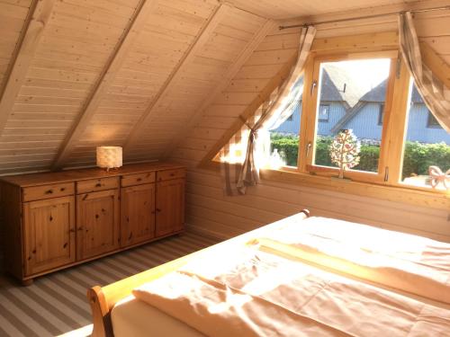 Postel nebo postele na pokoji v ubytování Blockhaus - de lüt holt hus