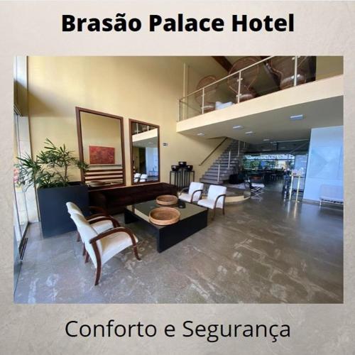 a room with a hotel with a table and chairs at Brasao Palace Hotel in Presidente Prudente
