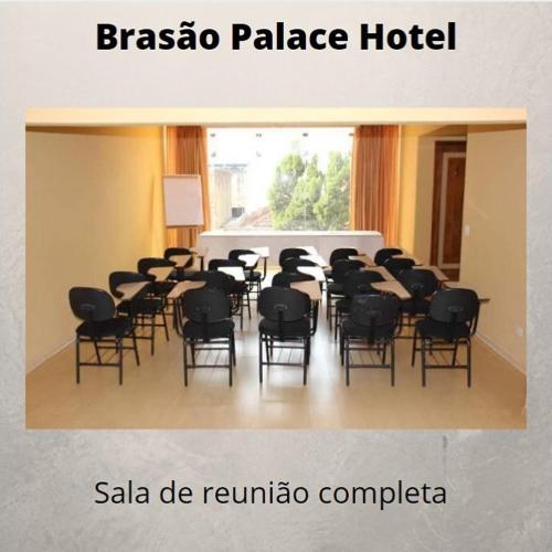 a room with a bunch of chairs and tables at Brasao Palace Hotel in Presidente Prudente