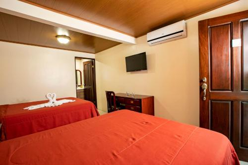 Postel nebo postele na pokoji v ubytování Orquideas Boutique Hotel