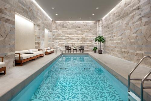 a large swimming pool in a hotel room at The Hazelton Hotel in Toronto