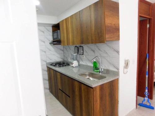 Dapur atau dapur kecil di Montenegro apartamento Completo