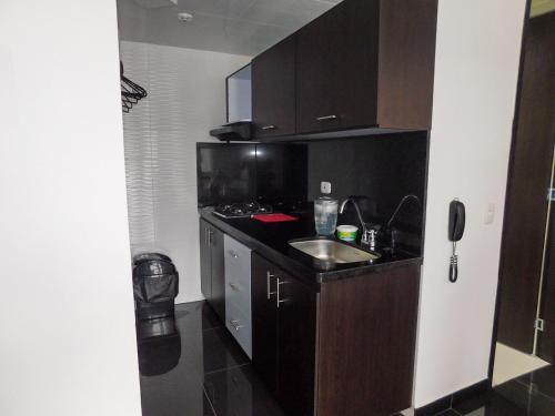 Dapur atau dapur kecil di Montenegro apartamento Completo
