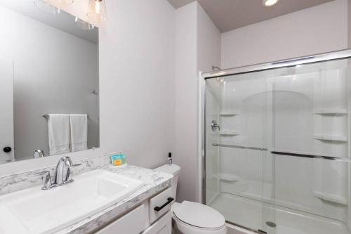 a bathroom with a shower and a sink and a toilet at Charming 3-bedroom in vibrant new neighborhood in Billings