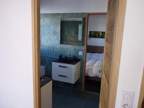 a bathroom with a bed and a sink and a mirror at Superbe appartement à Isola 2000, 8 couchages, parking privé, à 5 min des pistes et commerces - FR-1-292-112 in Isola 2000