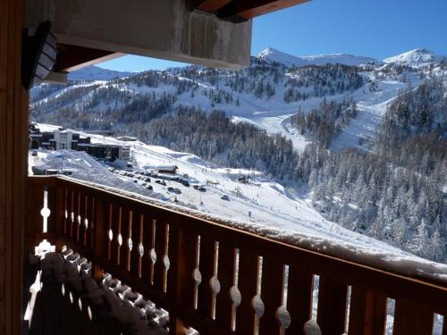 a view of a snow covered mountain from a balcony at Superbe appartement à Isola 2000, 8 couchages, parking privé, à 5 min des pistes et commerces - FR-1-292-112 in Isola 2000