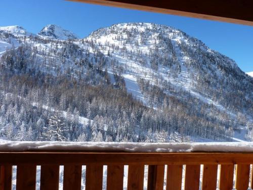 a view of a snow covered mountain from a window at Superbe appartement à Isola 2000, 8 couchages, parking privé, à 5 min des pistes et commerces - FR-1-292-112 in Isola 2000
