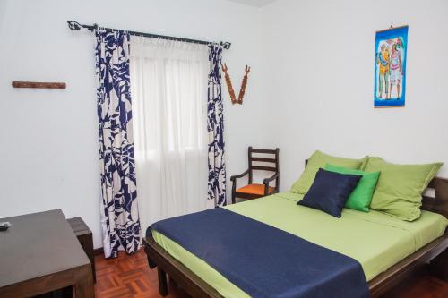 Un ou plusieurs lits dans un hébergement de l'établissement Palm Guest House