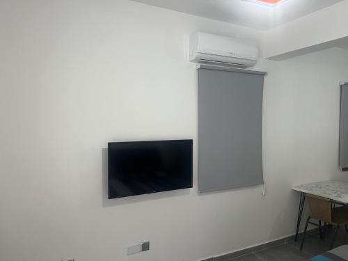 TV a/nebo společenská místnost v ubytování Smart Studios