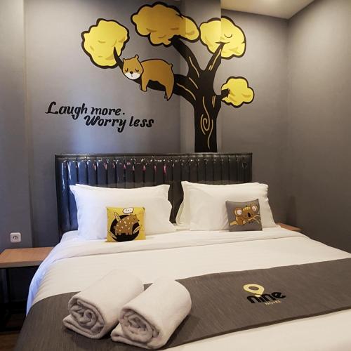 Postel nebo postele na pokoji v ubytování Nine Hotel