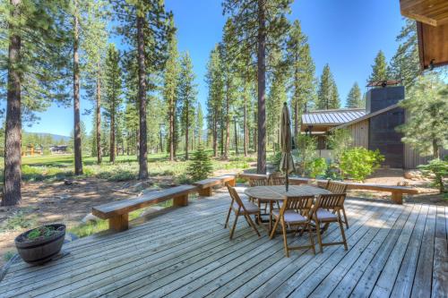 a wooden deck with a table and chairs at Sierra Vista in Truckee
