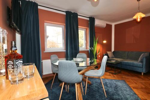 a living room with a table and chairs at Studio City in Ljubljana