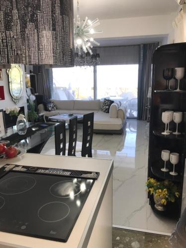 a kitchen and living room with a stove top oven at Villa Panorama, now a Smart Home in Skala Kallirakhis
