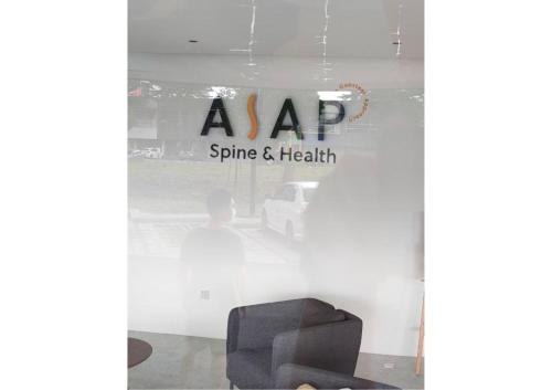 a window of a store with a chair in it at Cozy 2R2B Relaxing Skyline Views #GA2 in Shah Alam