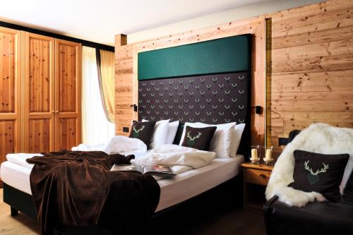 Ένα ή περισσότερα κρεβάτια σε δωμάτιο στο Boutique Hotel e Chalets Salvadori