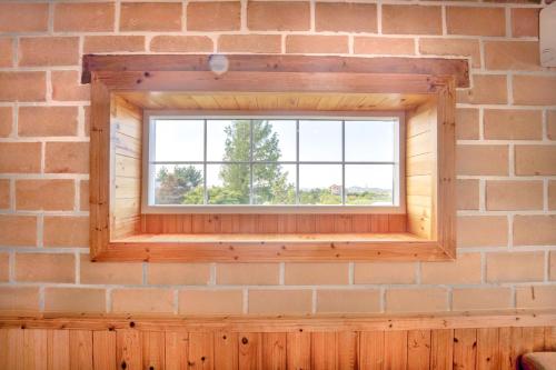 a window in a brick wall at Healing Camp Yesone in Gangneung