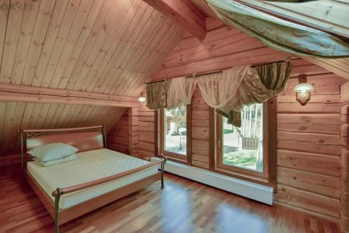 Säng eller sängar i ett rum på Villa Lohusalu