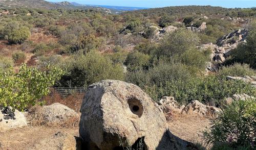 a large rock sitting on top of a mountain at Donnigheddu in Rudalza
