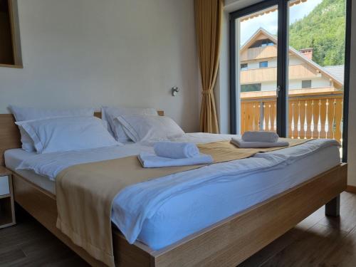 Postel nebo postele na pokoji v ubytování Apartments Vila Darja