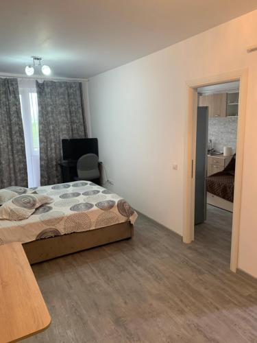 Кровать или кровати в номере Apartament for you