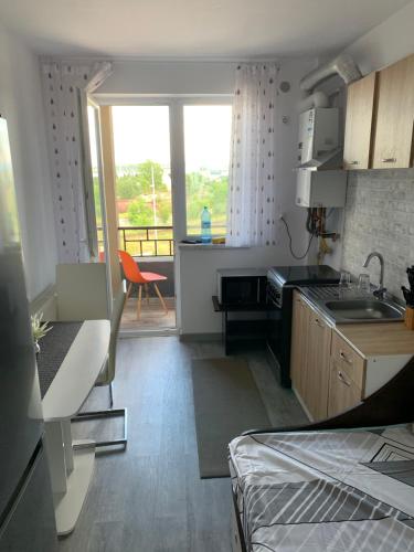 Кухня или мини-кухня в Apartament for you
