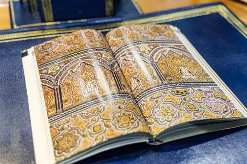 an open book with a design on the pages at Riad Rcif Alif Suite & SPA in Fès