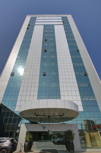 a tall building with a lot of windows at Viale Tower Hotel in Foz do Iguaçu