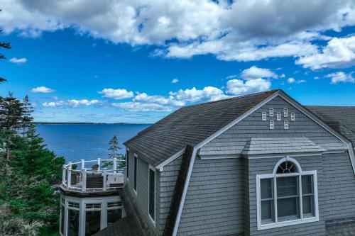a house with a view of the water at Barn at the Beach - Main House in Georgetown