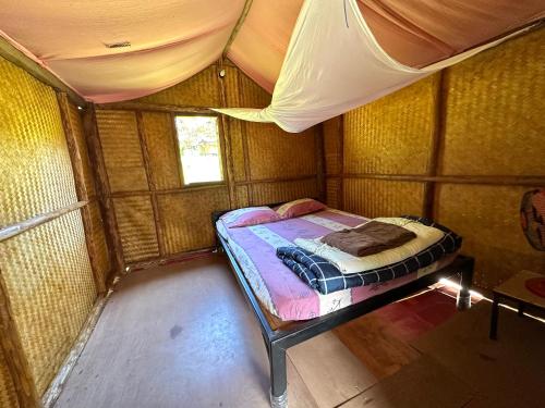 Postel nebo postele na pokoji v ubytování Twin Hut