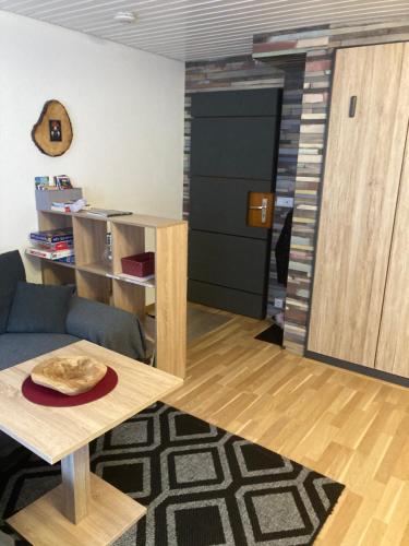 a living room with a couch and a table at Gemütliche Ferienwohnung in Sankt Blasien in St. Blasien