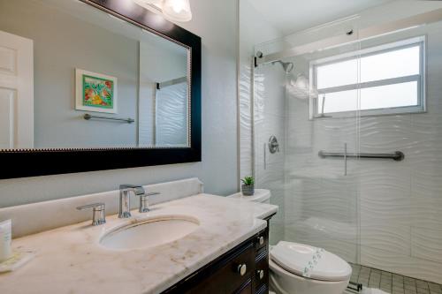 a bathroom with a sink and a glass shower at Ocean Reef At Deerfield #4 in Deerfield Beach