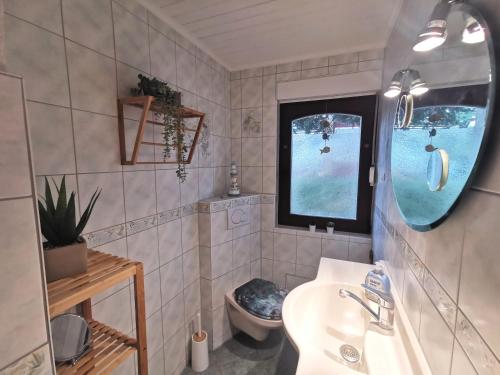 Koupelna v ubytování Haus am See