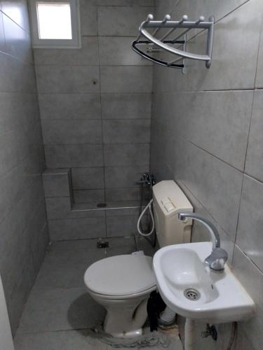a bathroom with a toilet and a sink at Moon light in Jerusalem