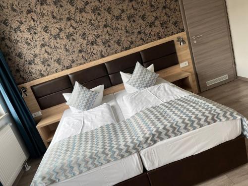 Postel nebo postele na pokoji v ubytování Hotel LACIN