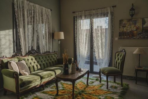 a living room with a couch and a table at Country house 2 in Ktistádes