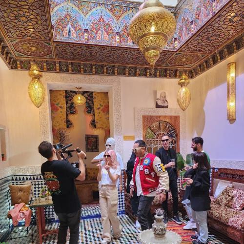 a group of people standing in a room in a house at Riad Dar Kassim in Fès