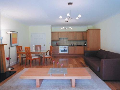 a living room with a couch and a table at Heyward Mews Holiday Homes in Swords