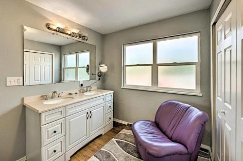 a bathroom with a sink and a purple chair at Three Bedroom, California King bed in Colorado Springs