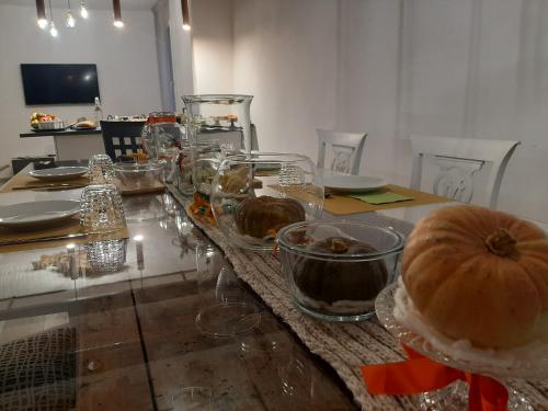 a table with plates and bowls of food on it at B&B da Baba in Ghizzano