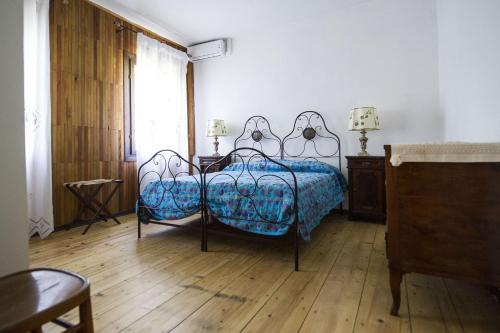 a bedroom with a bed and a table and a window at Casa Sincielli in Caorle
