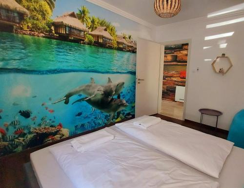 a bedroom with a painting of a swimming pool at Kikötő Sétány Apartman I. in Balatonszemes