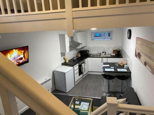 an overhead view of a kitchen with a fireplace at Lodge in Plymouth