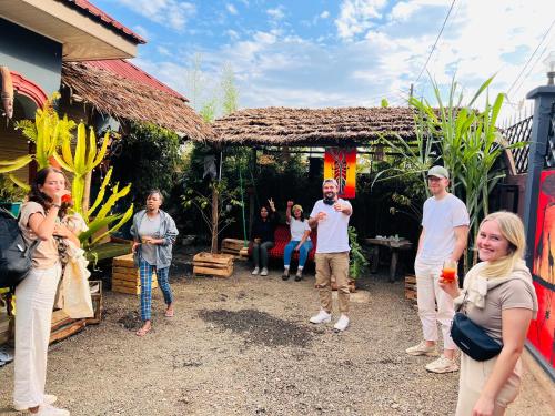 a group of people standing outside of a house at Savannah House in Arusha