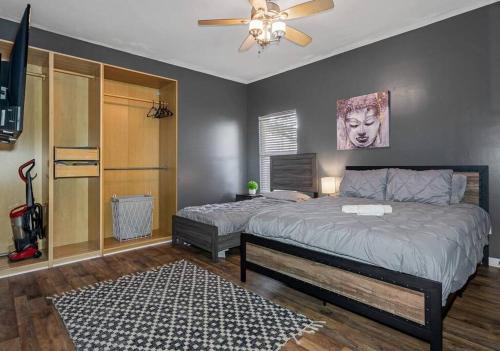 a bedroom with a bed and a ceiling fan at Wonderful 3 Bed 2 Bath House in Heart of YBOR City in Tampa