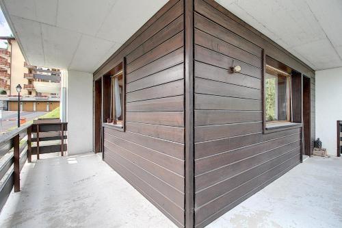 a large wooden garage door in a house at Prachalier II - Next to Nendaz cable car - Swiss Alps in Nendaz